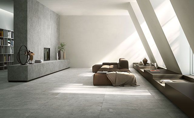 Modernes Wohnzimmer mit großen Fliesen in Steinoptik der Serie Quietstones Maximum von Fiandre